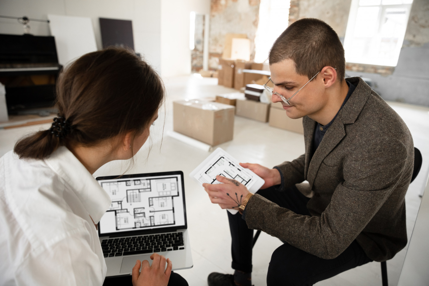 https://www.banyew.com/wp-content/uploads/2024/02/female-estate-agent-showing-new-home-young-man-after-discussion-house-plans-moving-new-home-concept.jpg
